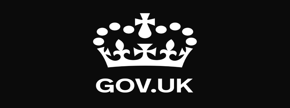 Government logo - Black background - white wording - white image of a crown
