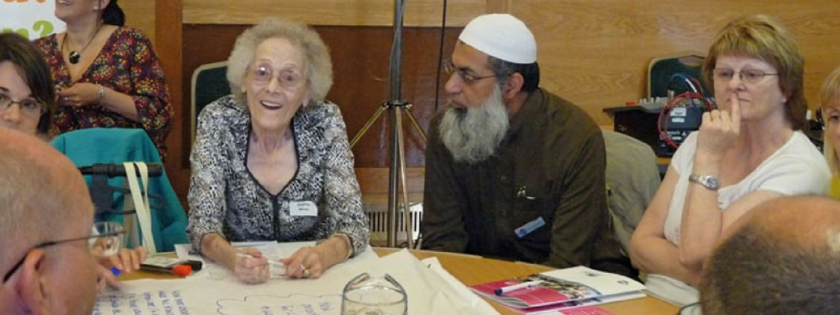 Group of people sat around a table