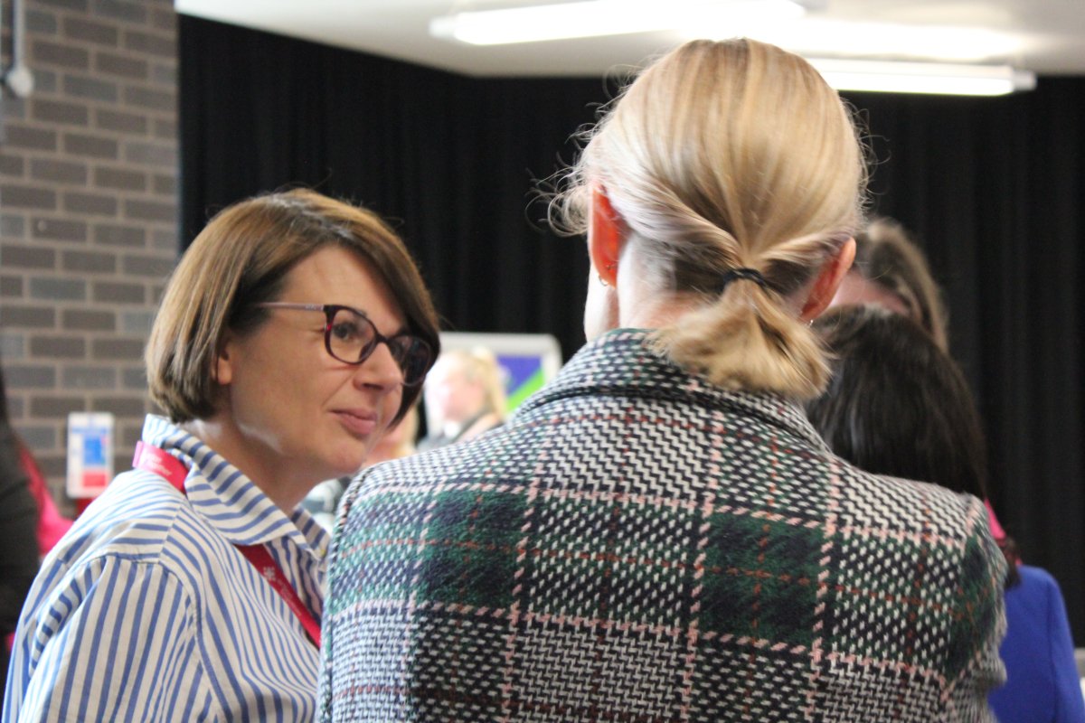 Staff member listening to someone speaking