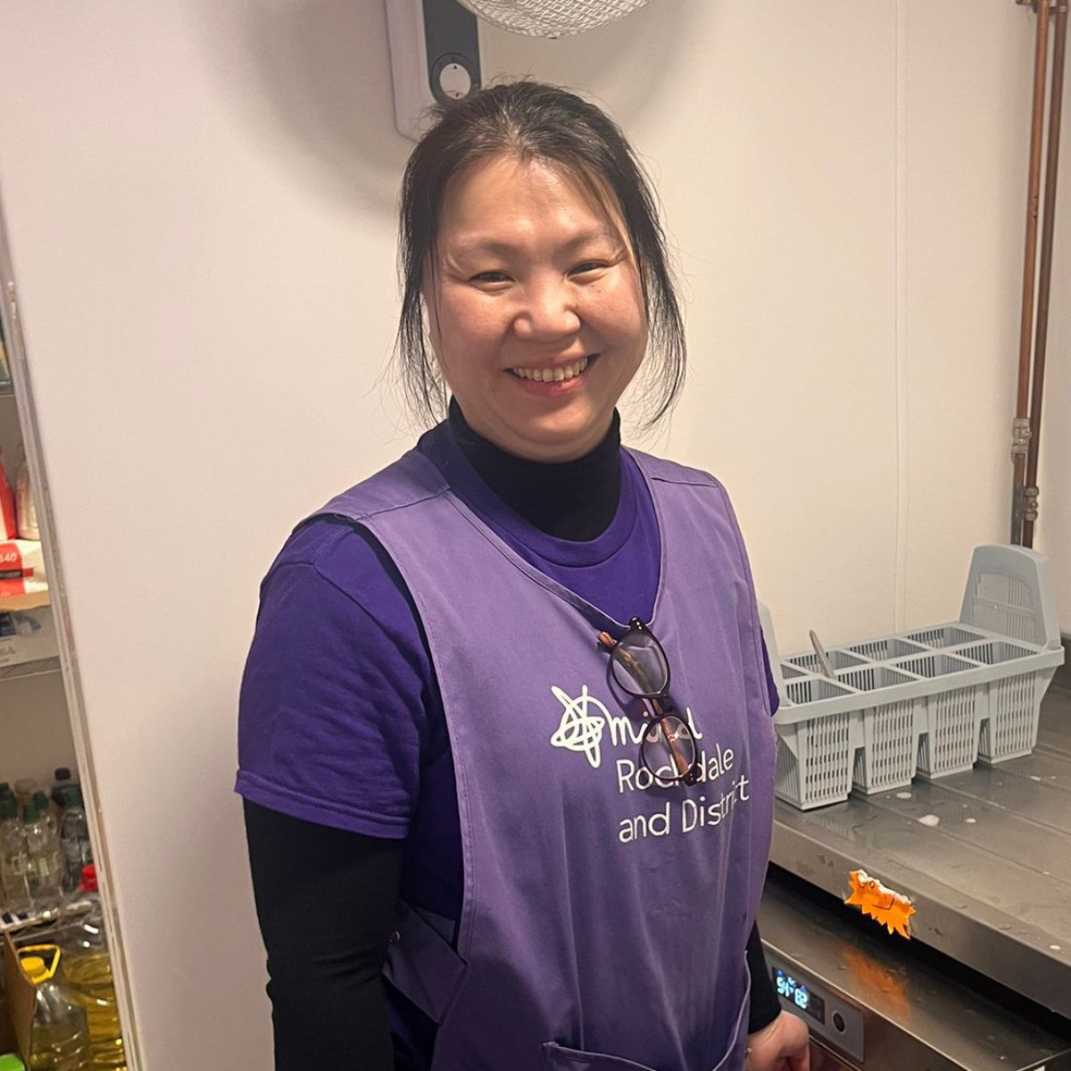 Rochdale Mind volunteer Ming smiling at camera