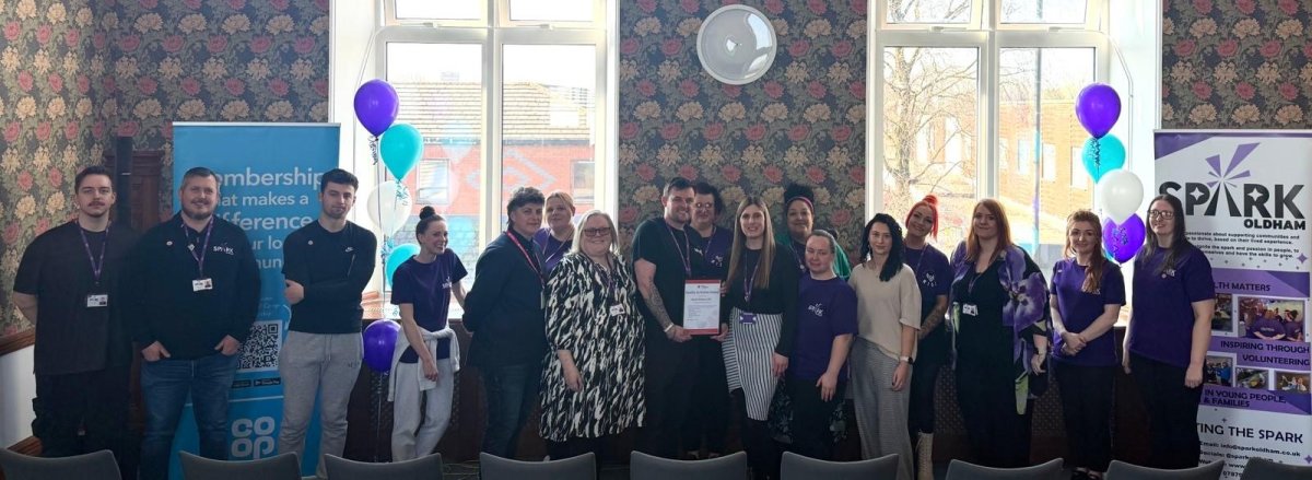 Group of people holding certificate 