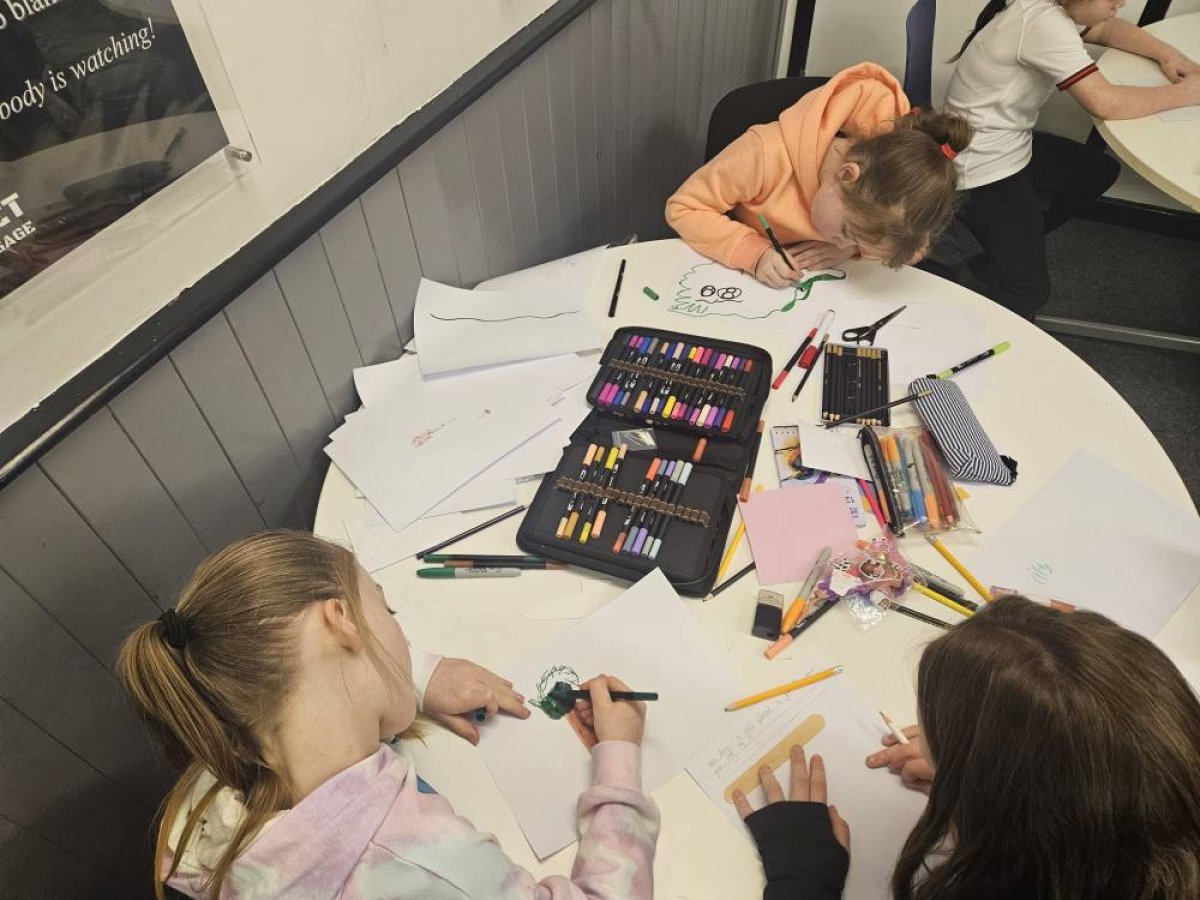 Photo of young people being creative