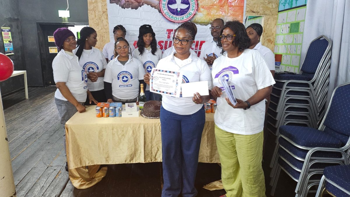 Woman receiving certificate and award