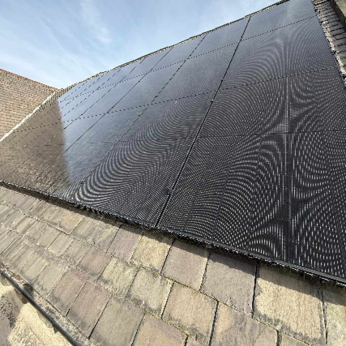 Photo of a parish hall roof with solar panels installed
