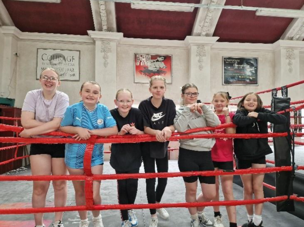 Girls stood inside a boxing ring