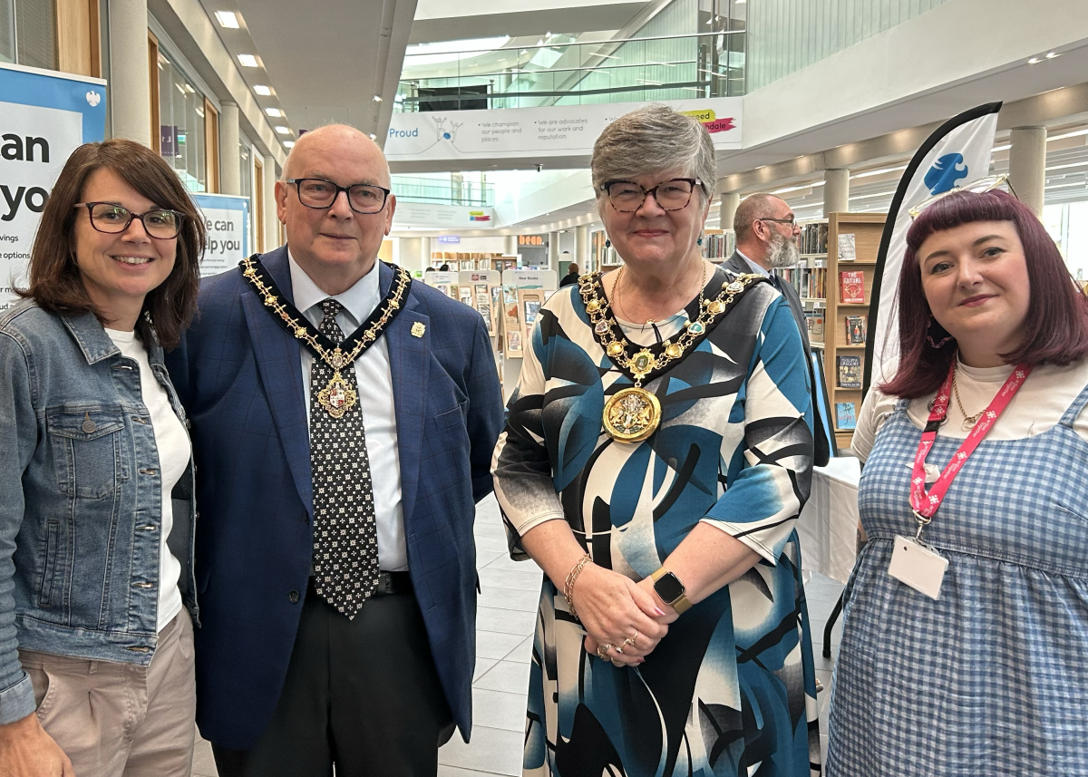 Four people smiling at Rochdale Volunteer Fair pictured left to right are Liz Windsor-Welsh, Mr Ken Emsley, Mayor Janet Emsley and Trish Cartner