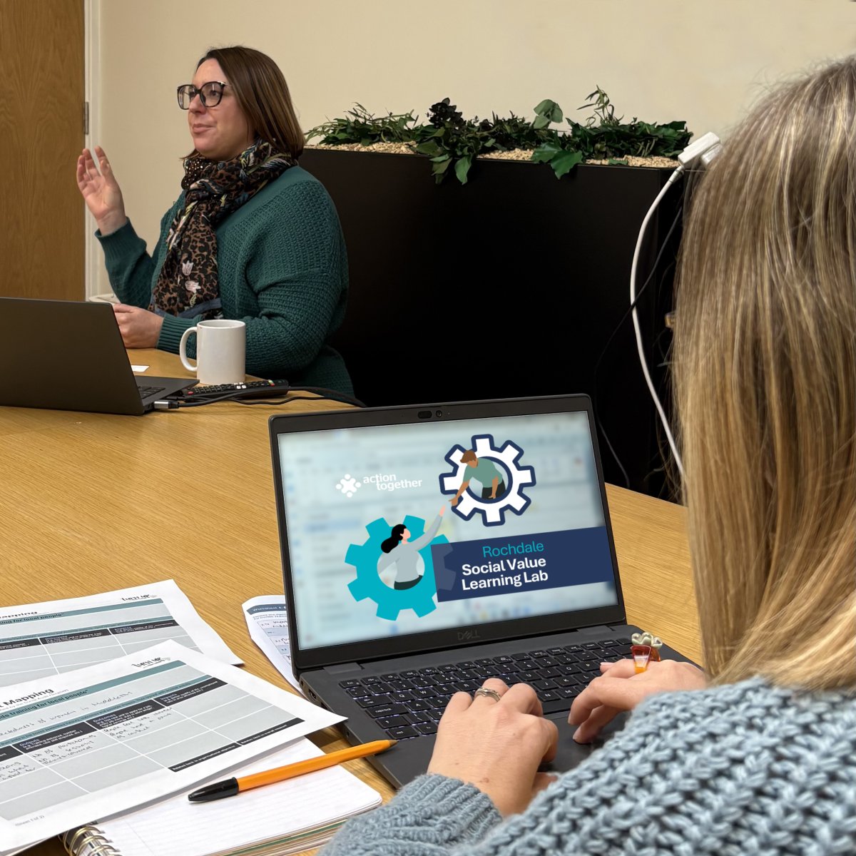 Person using laptop in group meeting with Karen Smith - Turn Up The Value - chdale Social Value Learning Lab on the screen