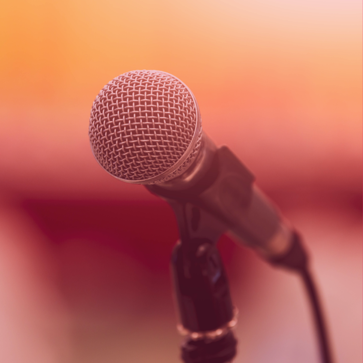 Image of a microphone on an orange background