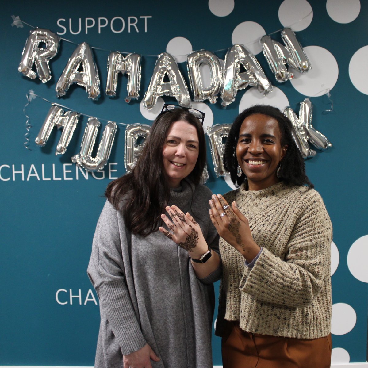 Women showing henna art