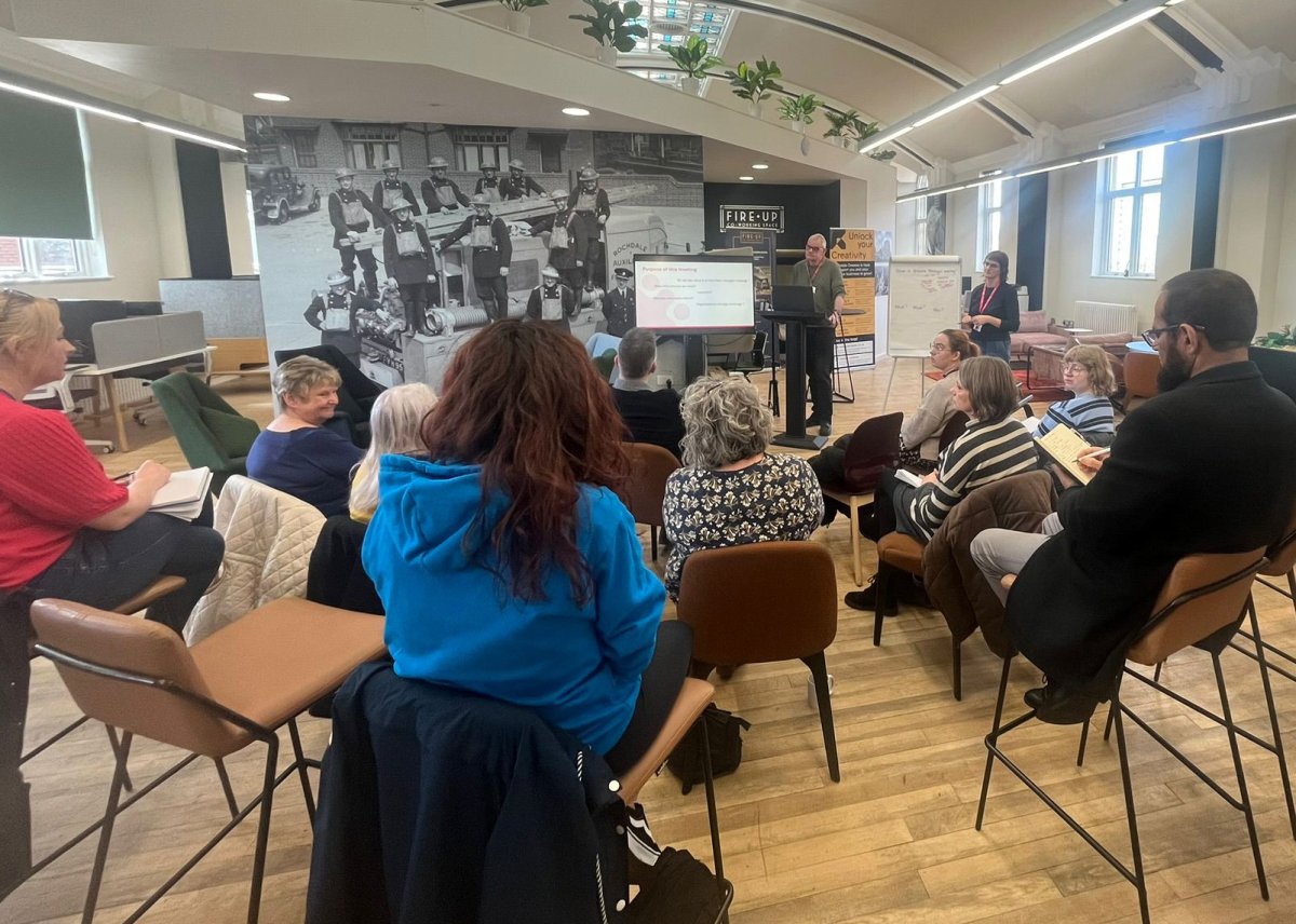 Volunteer Support Officer Phil Greenwood presenting to a group of people seated