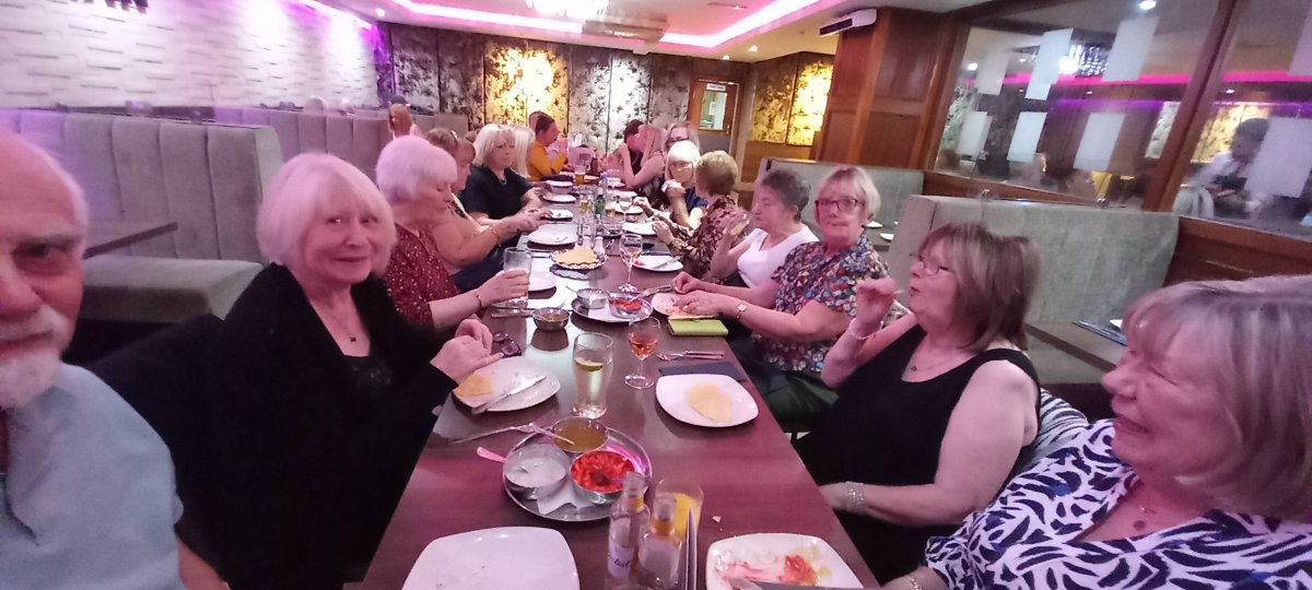 Volunteers enjoying a meal together