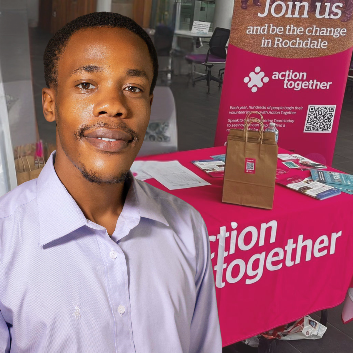 Volunteer Support Officer Hilson in from of volunteer exhibition stand