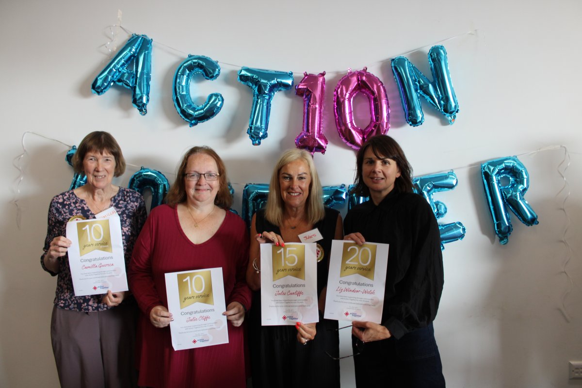 Staff holding up Long Service awards