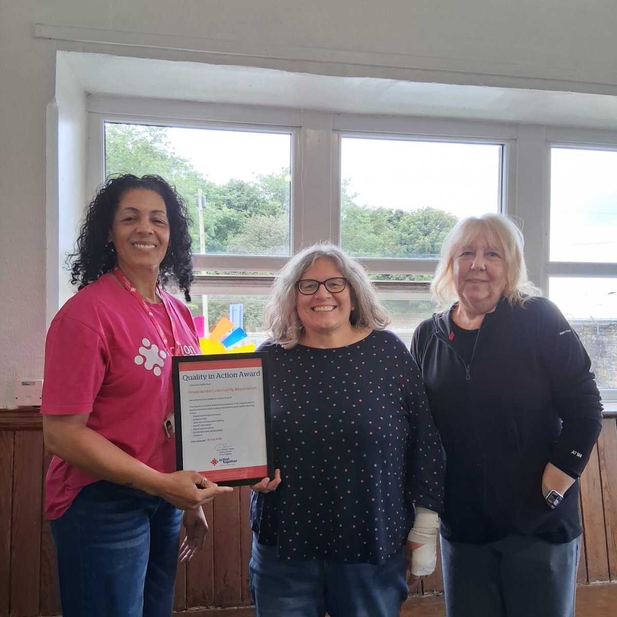 Group being awarded Quality In Action Award