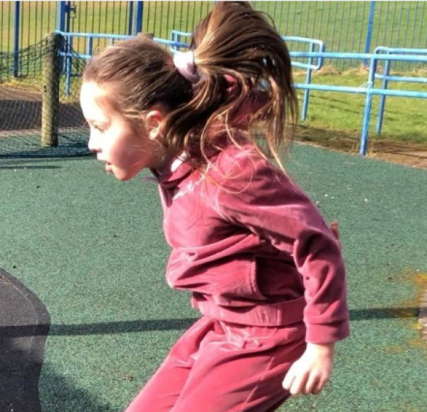 Girl jumping in playground