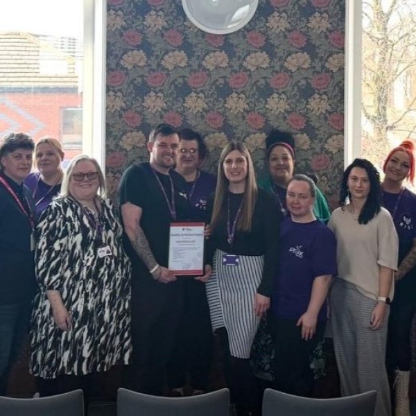 Group of people holding certificate 