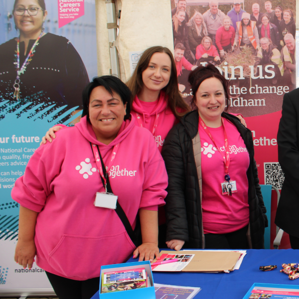 Volunteer team in pink jumpers