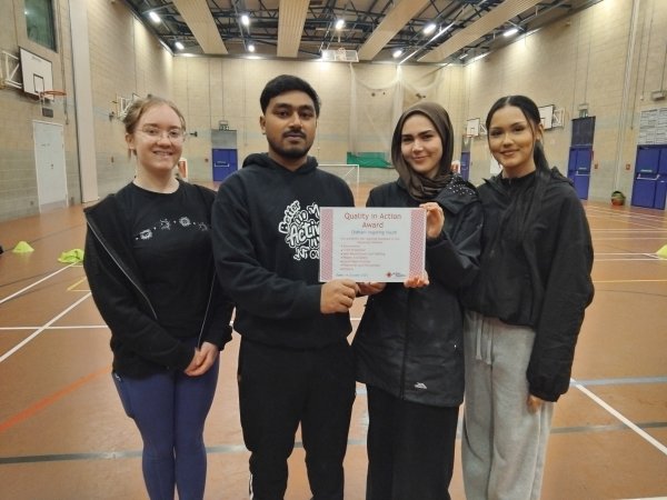 Oldham Inspiring Youth holding QiAA certificate