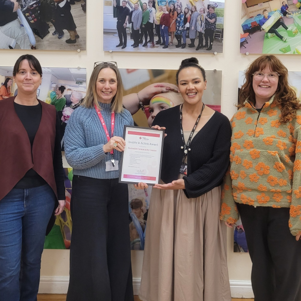 Rochdale CDW Annie Baker presenting Burnside Centre with their Quality in Action Award