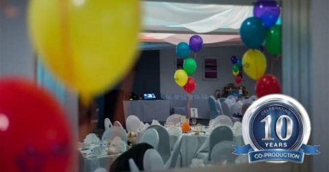 room with tables and balloons